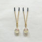 Gold nipple clamps with globe resin charm containing dried flowers – PurpleNight.ca
