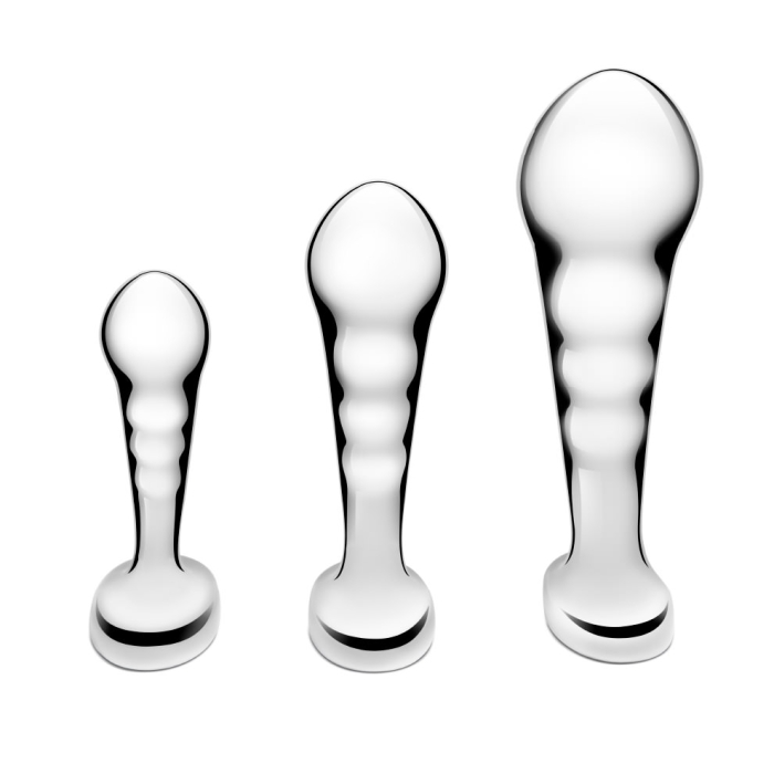 Three stainless steel anal plugs from the b-Vibe P-Spot Training Set in small, medium, and large sizes displayed against a reflective background.