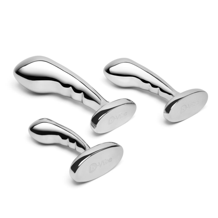 Three stainless steel anal plugs from the b-Vibe P-Spot Training Set in small, medium, and large sizes displayed against a reflective background.