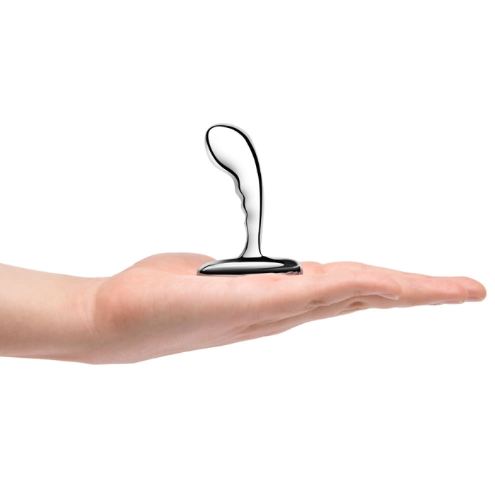 Three stainless steel anal plugs from the b-Vibe P-Spot Training Set in small, medium, and large sizes displayed against a reflective background.