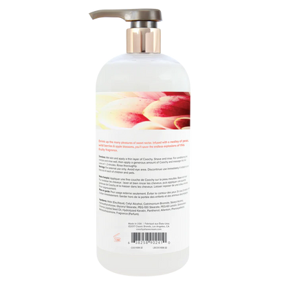 White bottle with pump and floral design on label against a white background