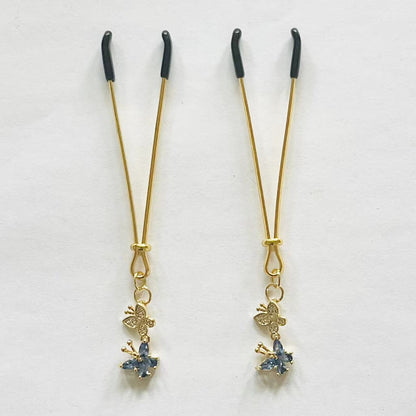 Elegant gold nipple clamps with blue crystal flower and butterfly charm – PurpleNight.ca