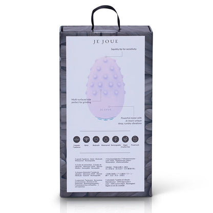 Je Joue Mimi Deux laying on soft fabric with USB charging cable

