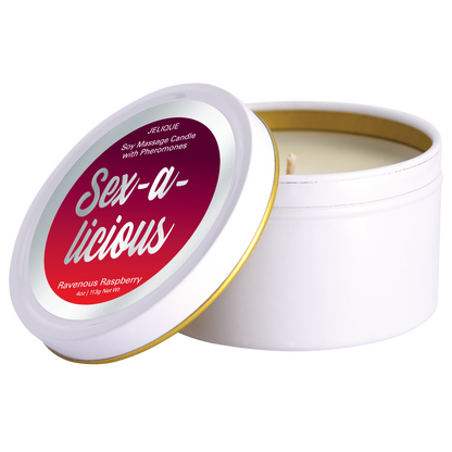 A white soy massage oil candle with a gold lid, labeled 'Sex-A-Licious Ravenous Raspberry' by Jelique.