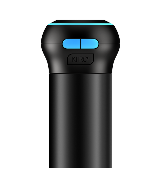 A black Kiiroo Control device with a blue accent on the top button. The device appears to be sleek and modern, with a small display and buttons for navigation.