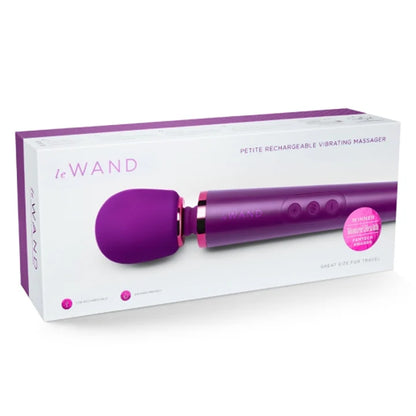 Purple and pink 'Le Wand' petite rechargeable vibrating massager on a white box
