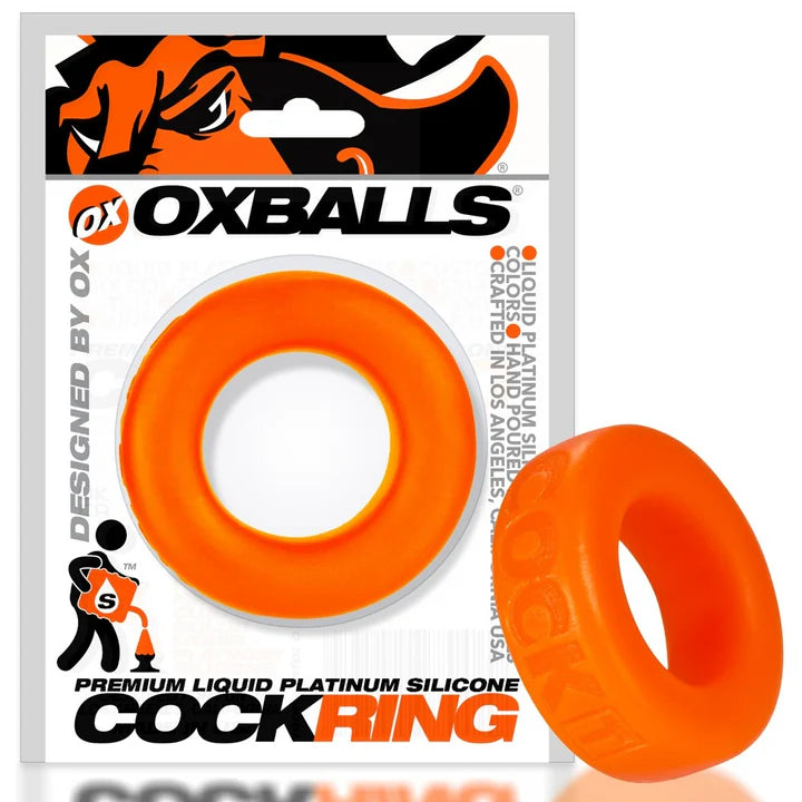 Orange cock ring with OxBalls packaging on a white background