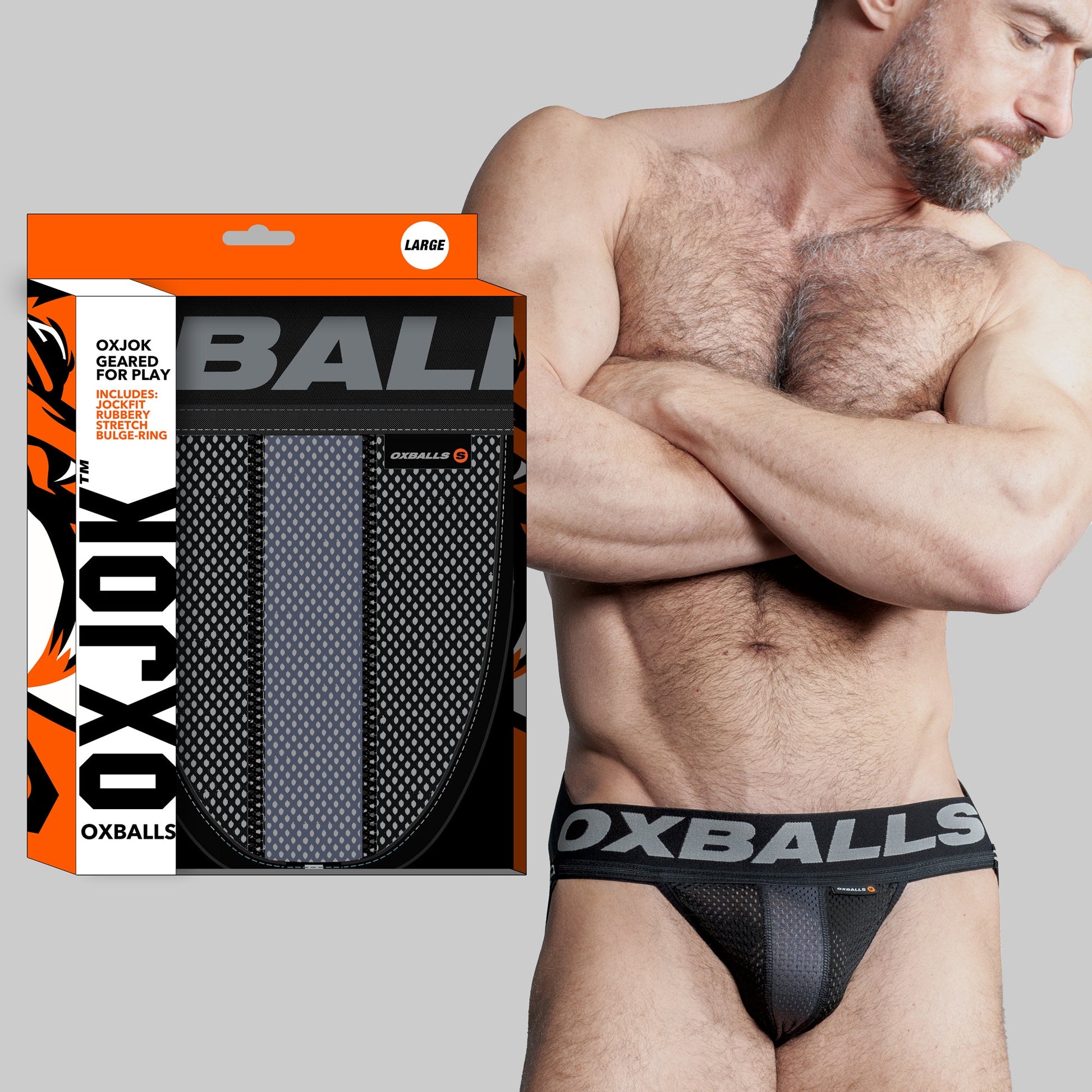 This image features the OXBALLS Airmesh Swagger Jockstrap in Tar Black, designed for both comfort and style. The jockstrap, which is predominantly black, includes a bold OXBALLS brand waistband that ensures a secure fit without rolling.