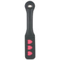 A black leather paddle with red heart-shaped embellishments on the handle.